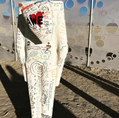 Burning Man guests draw on interactive figures